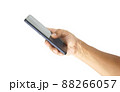 hand holding black smartphone isolated 88266057