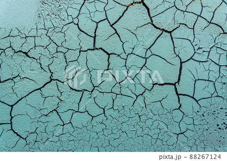 Cracked and damaged painted surface of a building or wall. Texture, aged paint background Cracked and damaged painted surface of a building or wall. Texture, aged paint background 88267124