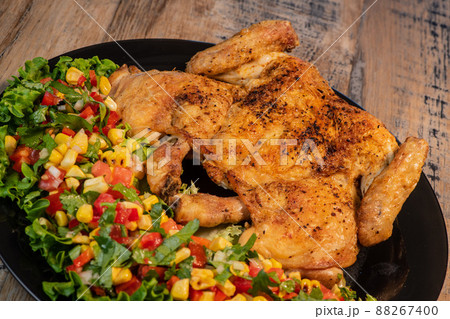 Chicken recipe, roast cockerel and its vegetables, corn condiment Chicken recipe, roast cockerel and its vegetables, corn condiment 88267400