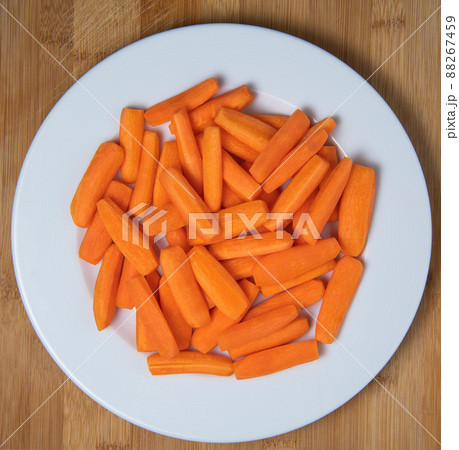 Preparing fresh carrots on wood table 88267459