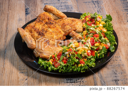 Chicken recipe, roast cockerel and its vegetables, corn condiment Chicken recipe, roast cockerel and its vegetables, corn condiment 88267574