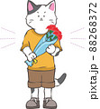 カーネーションの花束を持つ男の子の子猫 88268372