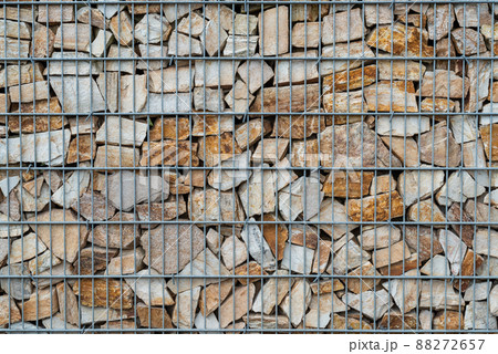 Gabion stone wall with metal grid as background 88272657