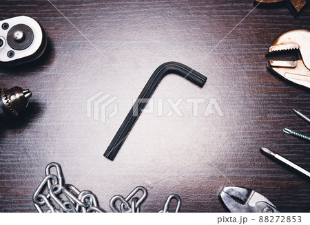 L shape hexagon tool on the hardwood table middle with mechanic tools alongside,low key L shape hexagon tool on the hardwood table middle with mechanic tools alongside,low key 88272853