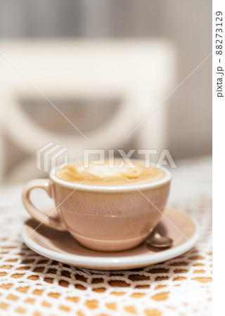Cup of cappuccino on table with soft blurred background 88273129