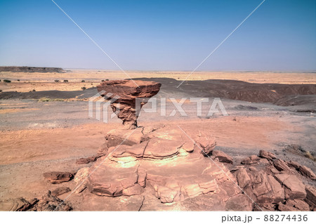 Rock formation at Sahara desert near Tchirozerine region, Agadez, Niger Rock formation at Sahara desert near Tchirozerine region, Agadez, Niger 88274436