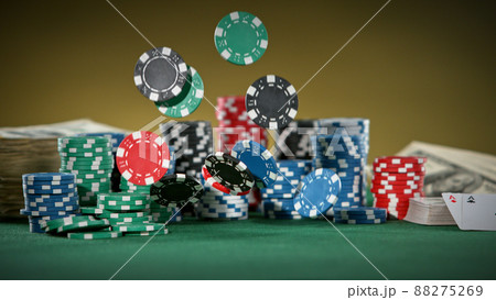 Falling poker chips on the table, macro shot Falling poker chips on the table, macro shot 88275269