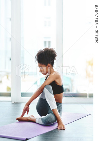 Youre only as good as you want to be. Shot of a beautiful young woman practising yoga in a studio. Youre only as good as you want to be. Shot of a beautiful young woman practising yoga in a studio. 88276879