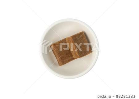 bouillon stock broth cubes,pork flavor in white bowl isolated on the white background with clipping path.Top view 88281233