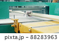 Factory press with a fiberglass frame moving through it 88283963