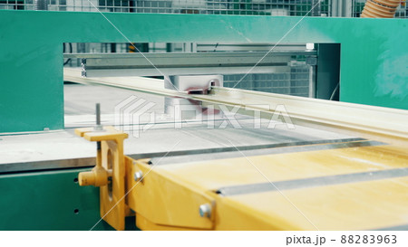 Factory press with a fiberglass frame moving through it 88283963