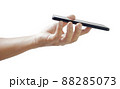 hand holding black smartphone isolated 88285073
