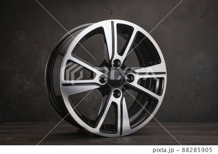 new black alloy wheels on a dark textured black background. wheel for car spare parts auto repair tire shop, new black alloy wheels on a dark textured black background. wheel for car spare parts auto repair tire shop, 88285905