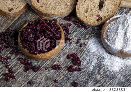 fresh cut bread made of flour and dried cranberries fresh cut bread made of flour and dried cranberries 88288354