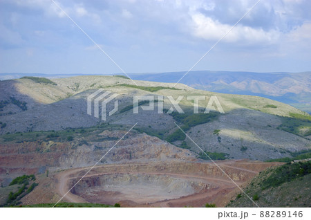 Beautiful hill covered with spring colours and marble quarry 88289146