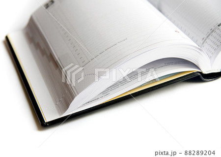 Business diary with a pen on a white background 88289204