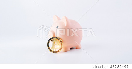 Save bitcoin money. Pink piggy bank with crypto coin BTC on white background. Saving currency money and financial concept bank. 88289497