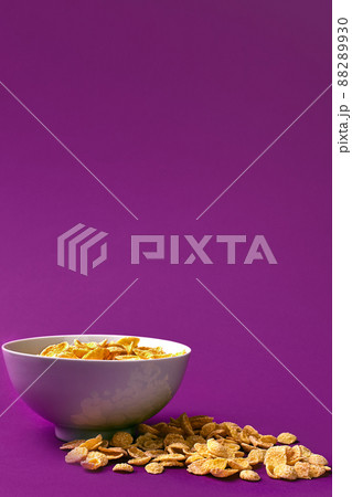 Bowl with cornflakes on the colorful background 88289930