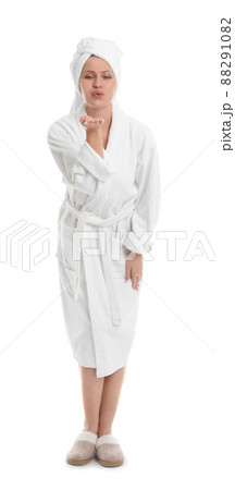 Young woman in bathrobe on white background Young woman in bathrobe on white background 88291082