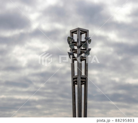 A metal lamp post with various lights. A metal lamp post with various lights. 88295803