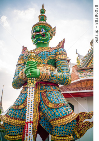 Giant stand statue in Wat Arun templeof dawn Giant stand statue in Wat Arun templeof dawn 88296058