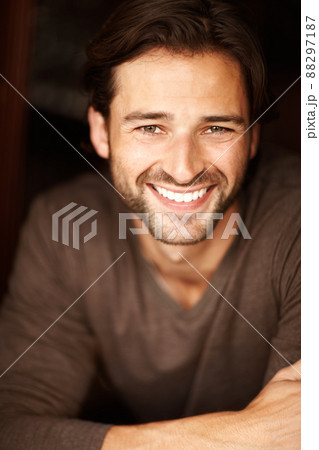 Hansome and happy with life. Portrait of a handsome young man smiling. 88297187