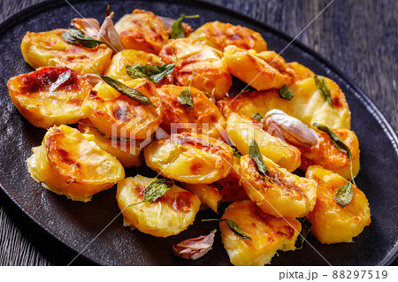 roasted squashed potatoes with garlic and sage roasted squashed potatoes with garlic and sage 88297519