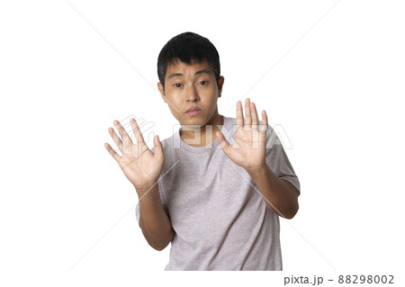 Portrait of young man show stop gesture sign by hand. Portrait of young man show stop gesture sign by hand. 88298002