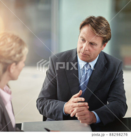 Just a couple of points.... Cropped shot of two businesspeople in a meeting. Just a couple of points.... Cropped shot of two businesspeople in a meeting. 88298276