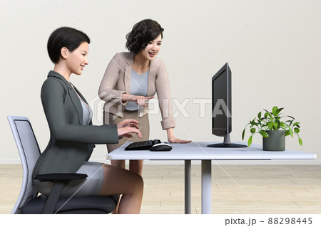 パソコン作業のビジネスウーマンに指導する笑顔の女性社員 88298445