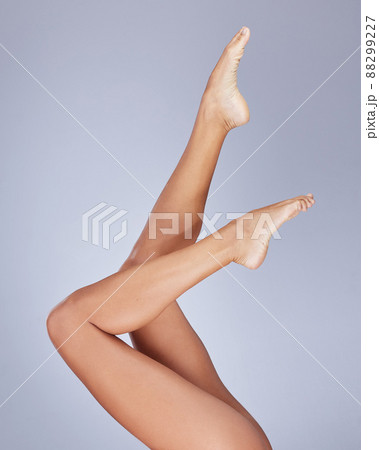Loving every inch of my body. Cropped shot of an unrecognizable woman showing her legs while posing in the studio. 88299227