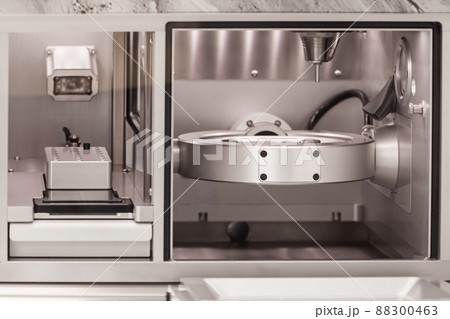 Cad cam milling machine in dental laboratory. Production of high esthetic dental crowns and dentures. Cad cam milling machine in dental laboratory. Production of high esthetic dental crowns and dentures. 88300463