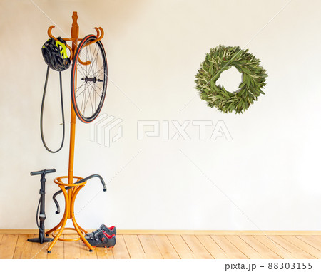 The cyclist equipment of champion with hanger in the room with laurel wreath. 88303155
