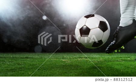 Soccer player in action, ready to kick the ball Soccer player in action, ready to kick the ball 88312512
