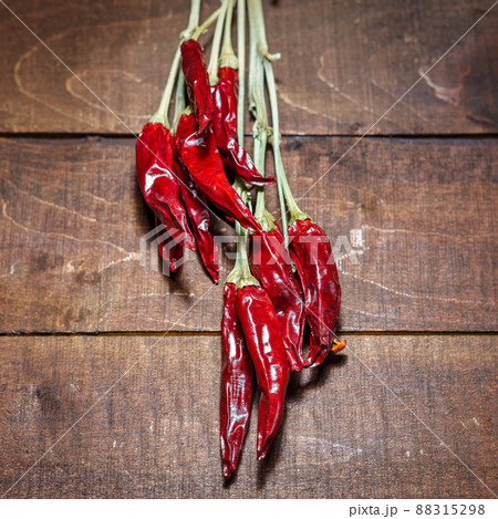 Red hot chili peppers on a wooden background 88315298