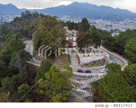 Aerial Drone shot of Church Iglesia de San Cristobalito on the mountain in San Cristobal de Las Casas, Chiapas, Mexico Aerial Drone shot of Church Iglesia de San Cristobalito on the mountain in San Cristobal de Las Casas, Chiapas, Mexico 88317415