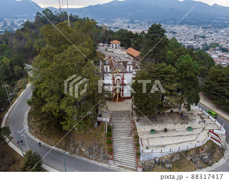Aerial Drone shot of Church Iglesia de San Cristobalito on the mountain in San Cristobal de Las Casas, Chiapas, Mexico Aerial Drone shot of Church Iglesia de San Cristobalito on the mountain in San Cristobal de Las Casas, Chiapas, Mexico 88317417