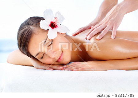 Lost in spa bliss. Gorgeous young woman relaxing during a spa massage. Lost in spa bliss. Gorgeous young woman relaxing during a spa massage. 88317788