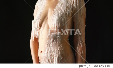 Crop woman with wax on naked body 88325336