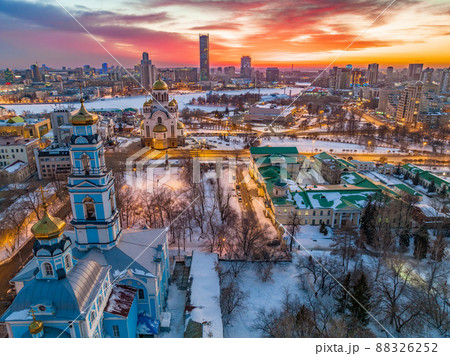 Winter Yekaterinburg, Temple of the Ascension and Temple on Blood in beautiful pink and orange sunset. 88326252