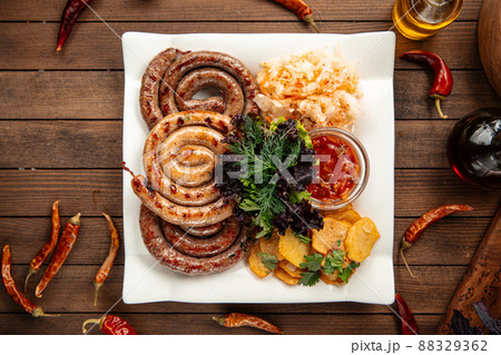 Assorted grilled sausages with sauerkraut Assorted grilled sausages with sauerkraut 88329362