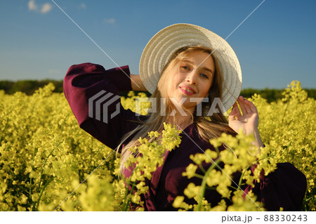 woman in a blooming field 88330243