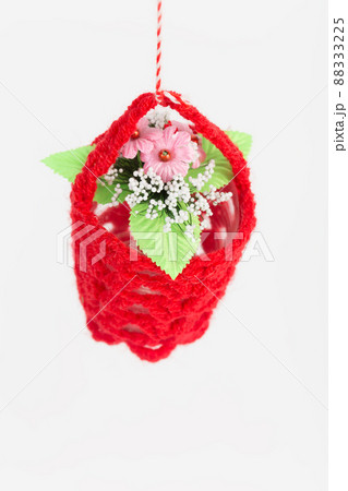 A flower pot in a knitted cover. A flower pot in a knitted cover. 88333225