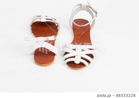 White leather women's sandals with low heels. 88333228