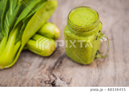 Ginger green apple smoothie on concrete background. It can be used as a background Ginger green apple smoothie on concrete background. It can be used as a background 88336455