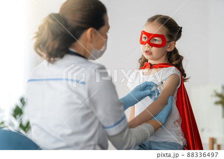 Doctor vaccinating child Doctor vaccinating child 88336497