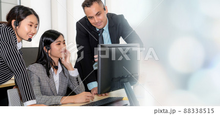 Business people wearing headset working in office broaden view 88338515