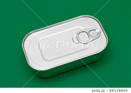 Unopened Tin Can with Blank Edge on Green Background Unopened Tin Can with Blank Edge on Green Background 88338804