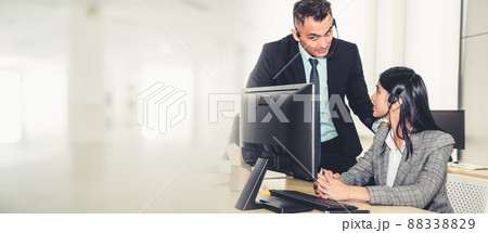 Business people wearing headset working in office broaden view Business people wearing headset working in office broaden view 88338829