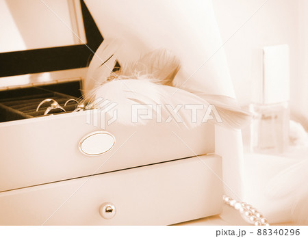 Jewelry box with fashion accessories in pastel coral toning Jewelry box with fashion accessories in pastel coral toning 88340296
